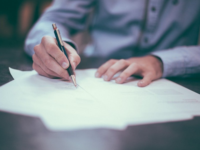 Family lawyer reviewing separation documents at a desk