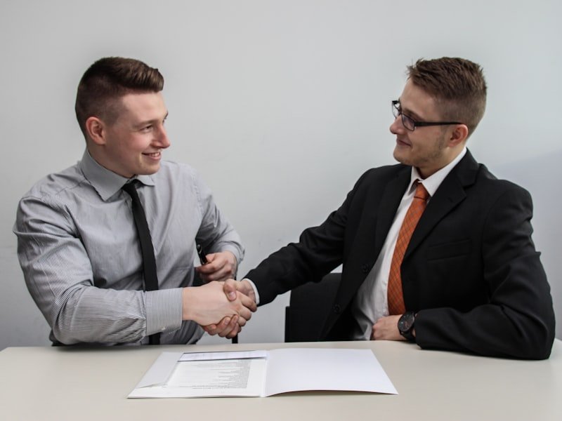 Two people shaking hands after reaching agreement